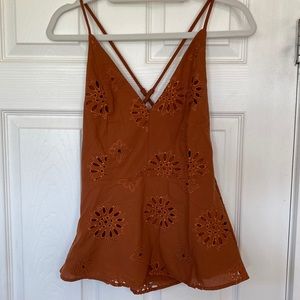 Peplum eyelet top